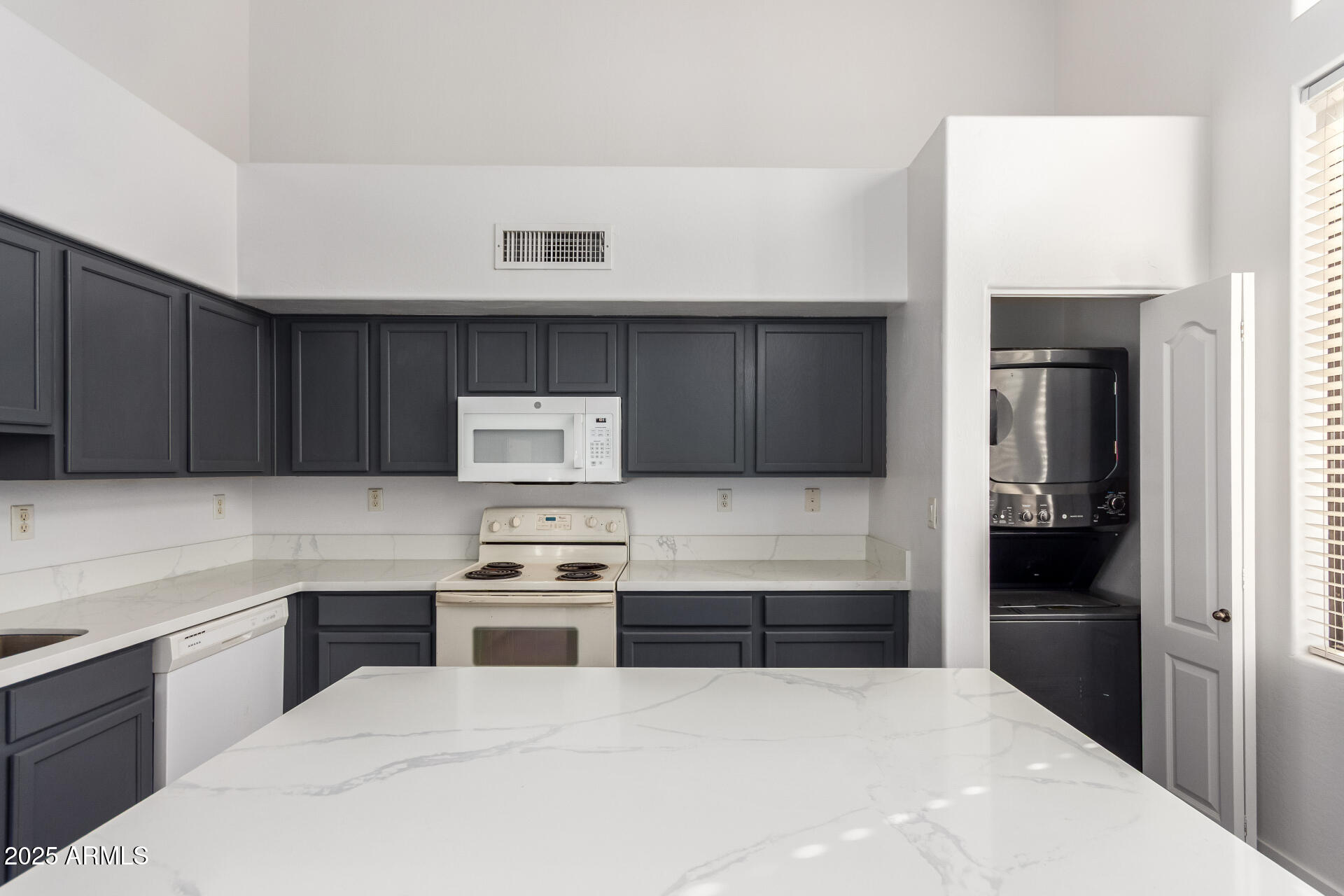 738 South Beck Avenue Tempe, AZ 85281 - Photo 13 of 31 a kitchen with a refrigerator and a stove top oven