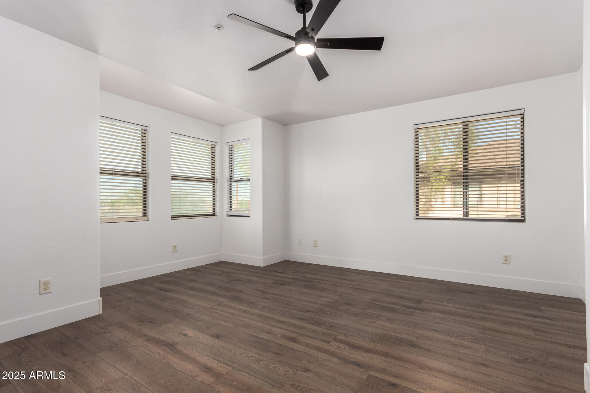 738 South Beck Avenue Tempe, AZ 85281 - Photo 15 of 31 an empty room with wooden floor ceiling fan and windows