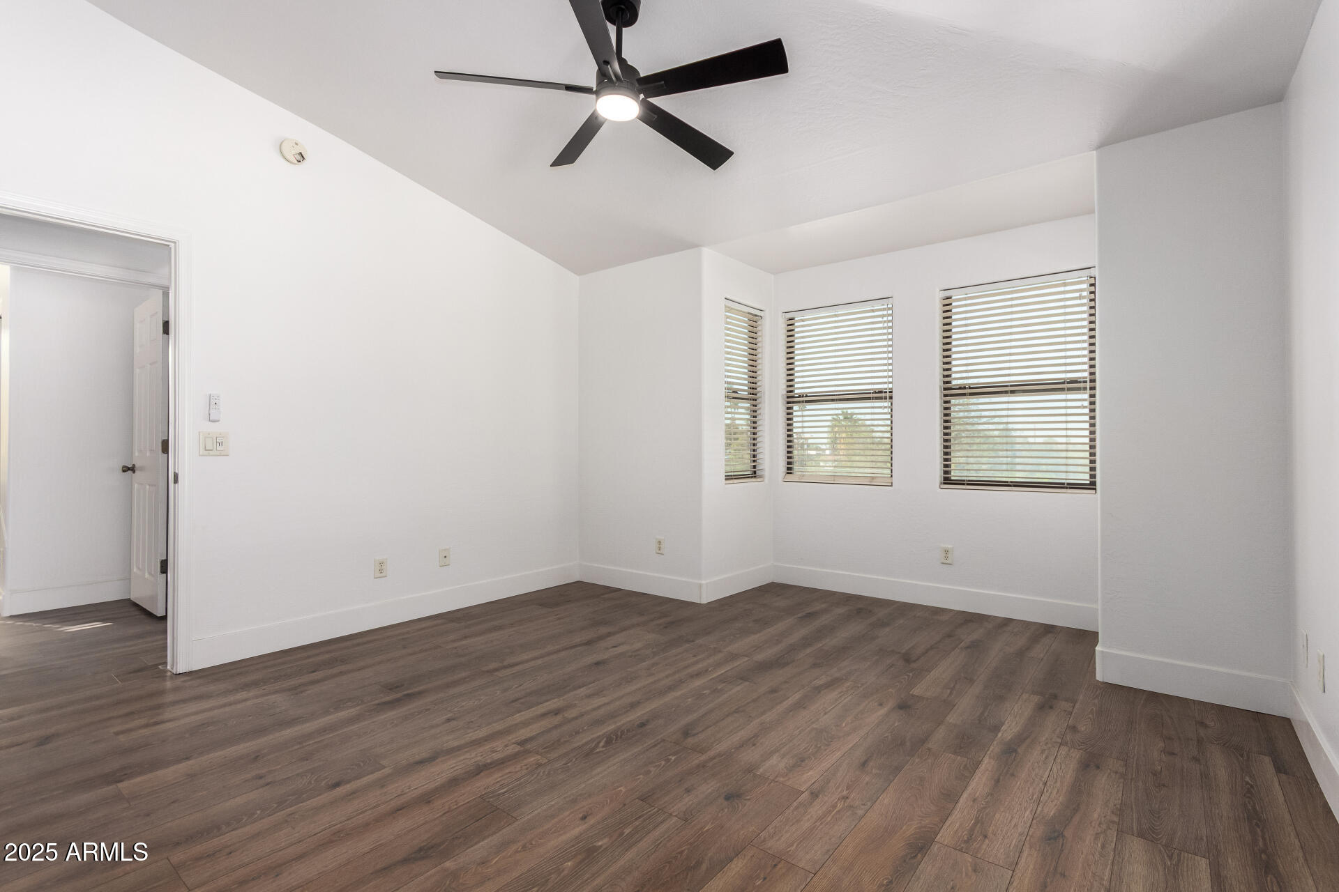 738 South Beck Avenue Tempe, AZ 85281 - Photo 16 of 31 an empty room with wooden floor ceiling fan and windows