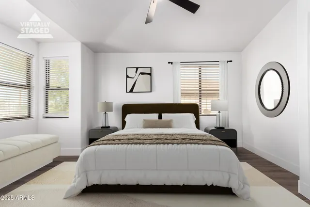 a bedroom with a bed a mirror and a window