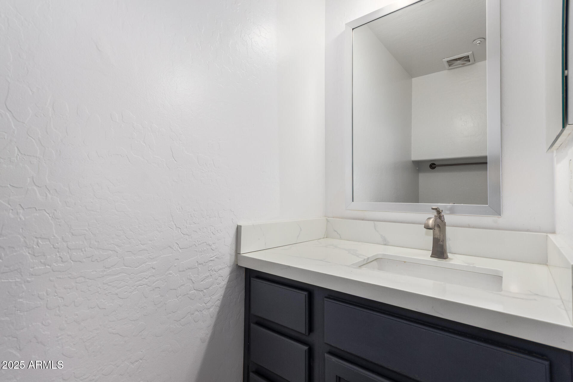 738 South Beck Avenue Tempe, AZ 85281 - Photo 24 of 31 a bathroom with a sink and mirror