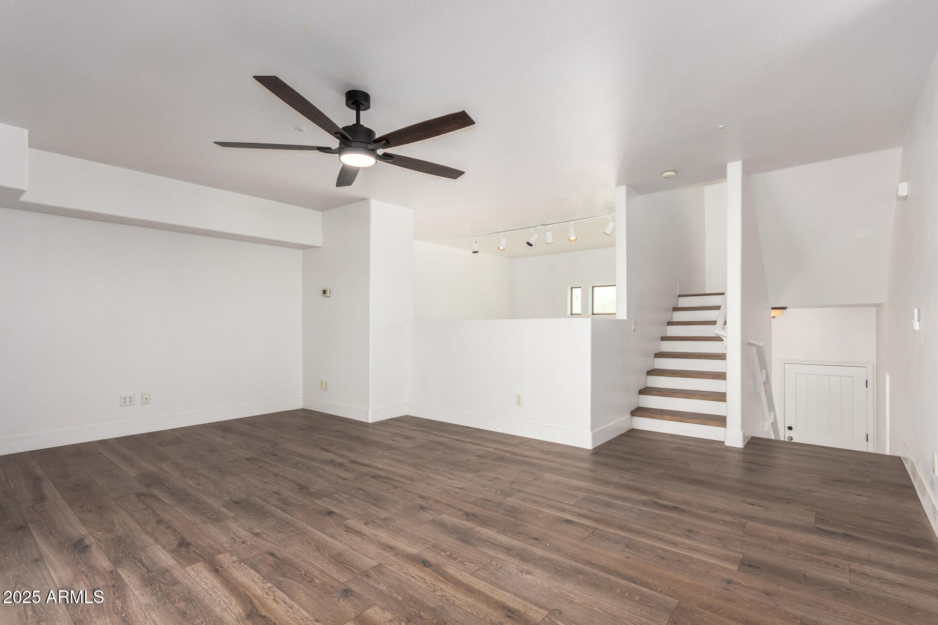 738 South Beck Avenue Tempe, AZ 85281 - Photo 5 of 31 a view of a livingroom with wooden floor and white walls