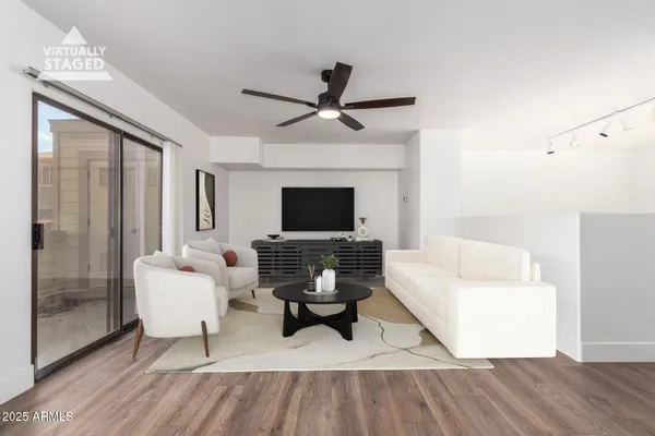 a living room with furniture and a fireplace