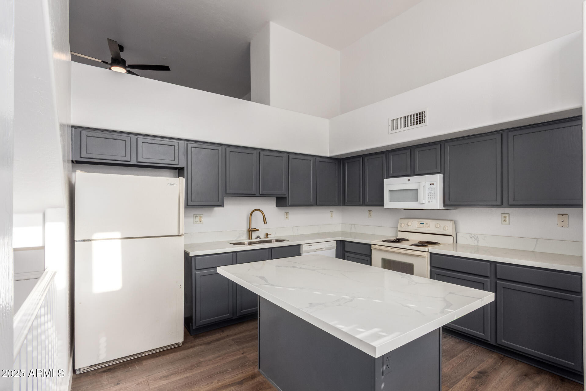 738 South Beck Avenue Tempe, AZ 85281 - Photo 10 of 31 a kitchen with stainless steel appliances a refrigerator a sink a stove a microwave and wooden cabinets