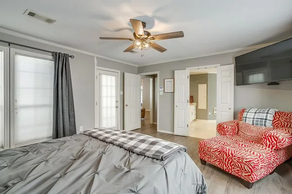 a bedroom with a bed and a couch