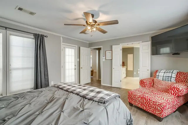 a bedroom with a bed and a couch