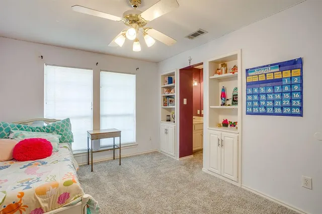 a view of livingroom with furniture and chandelier fan