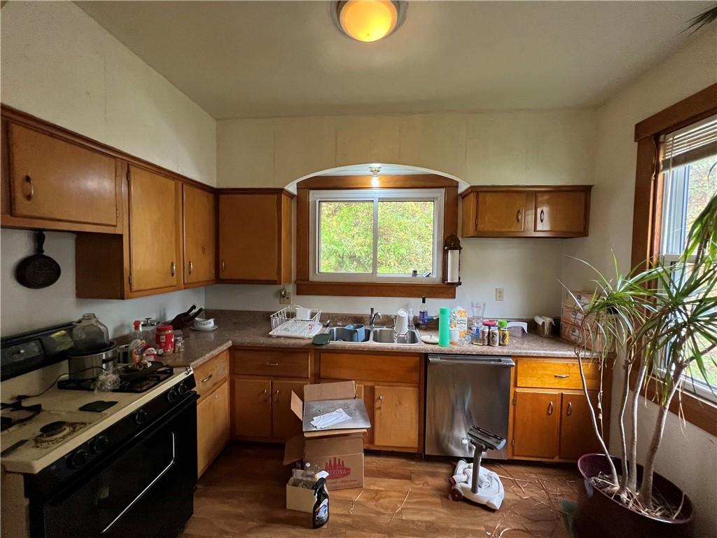 147 Clarks Pike Road Creighton, PA 15030 - Photo 6 of 26 a kitchen with sink refrigerator and cabinets