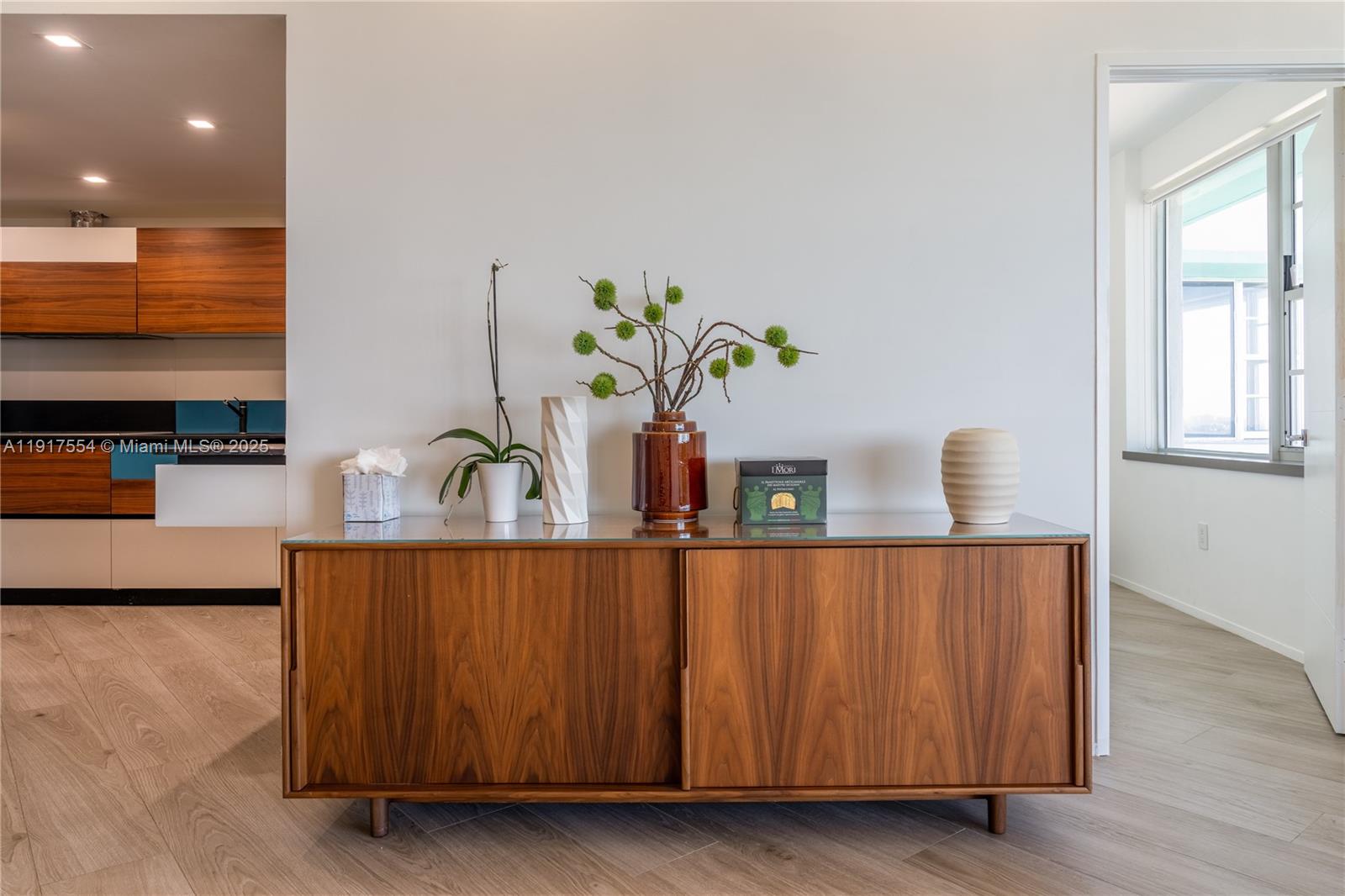 5255 Collins Avenue, Unit 12F Miami Beach, FL 33140 - Photo 26 of 45 a dining room with furniture and window
