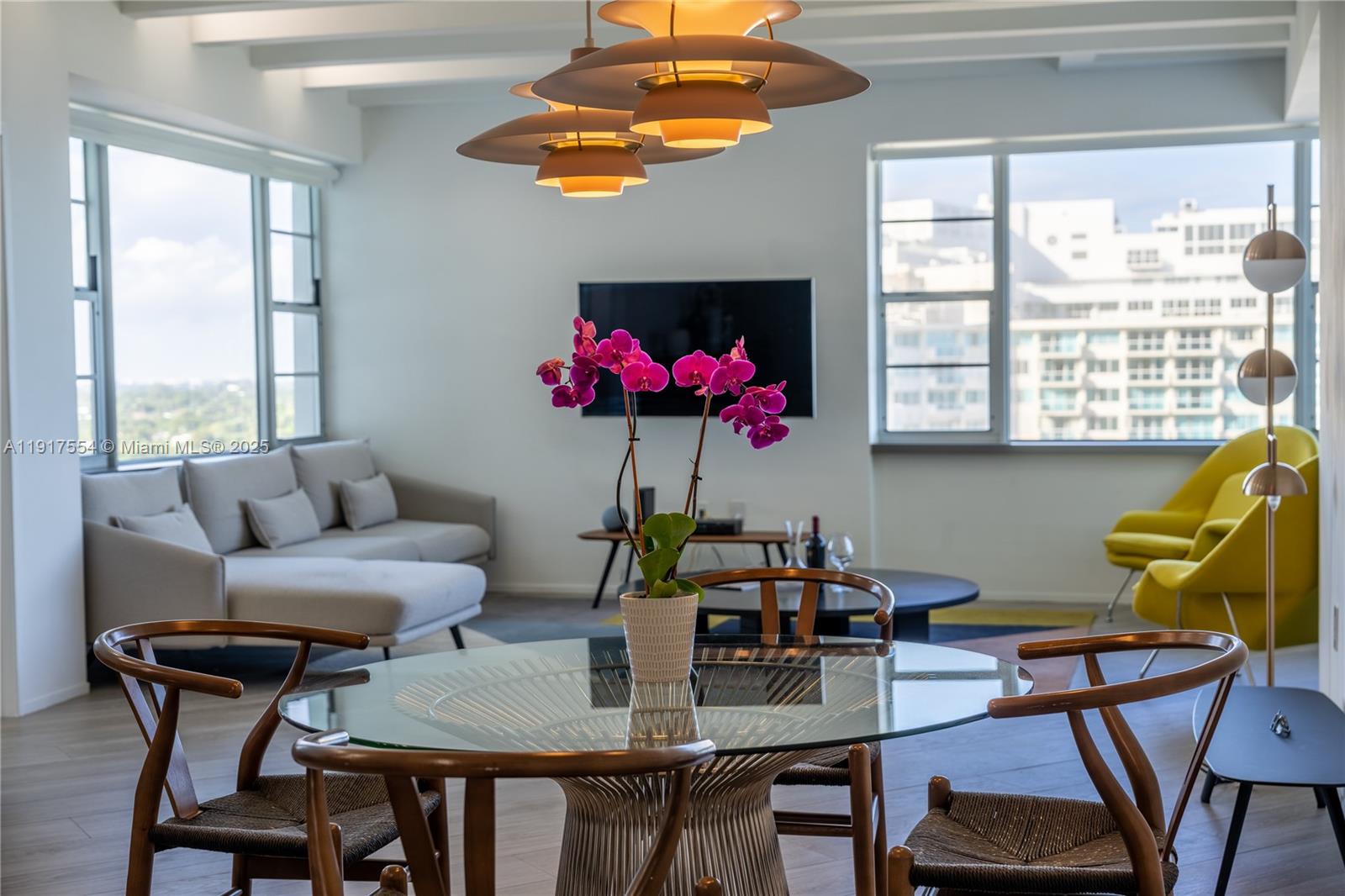 5255 Collins Avenue, Unit 12F Miami Beach, FL 33140 - Photo 28 of 45 a view of a dining room with furniture window and outside view