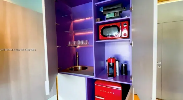 a couple of cars parked in front of a building