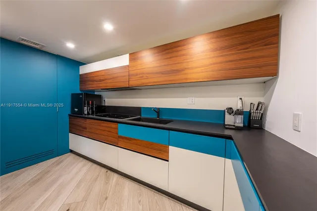 a view of room with stairs and wooden floor