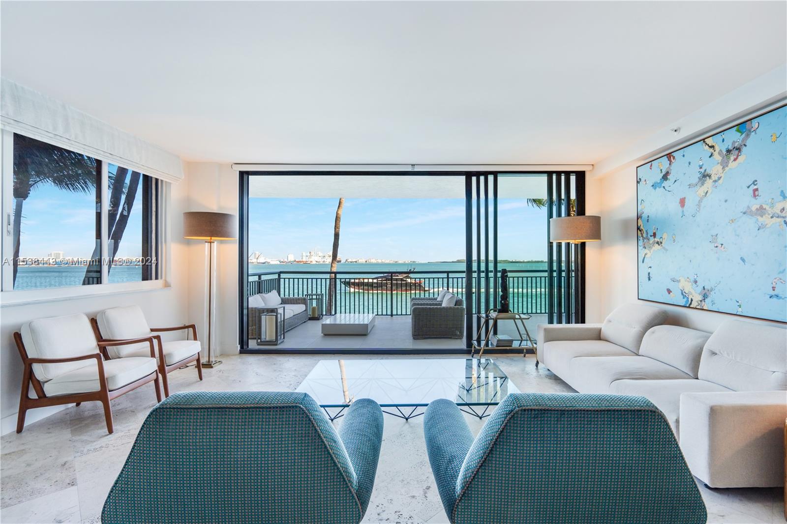 540 Brickell Key Drive, Unit 320 Miami, FL 33131 - Photo 1 of 32 a living room with furniture and a large window