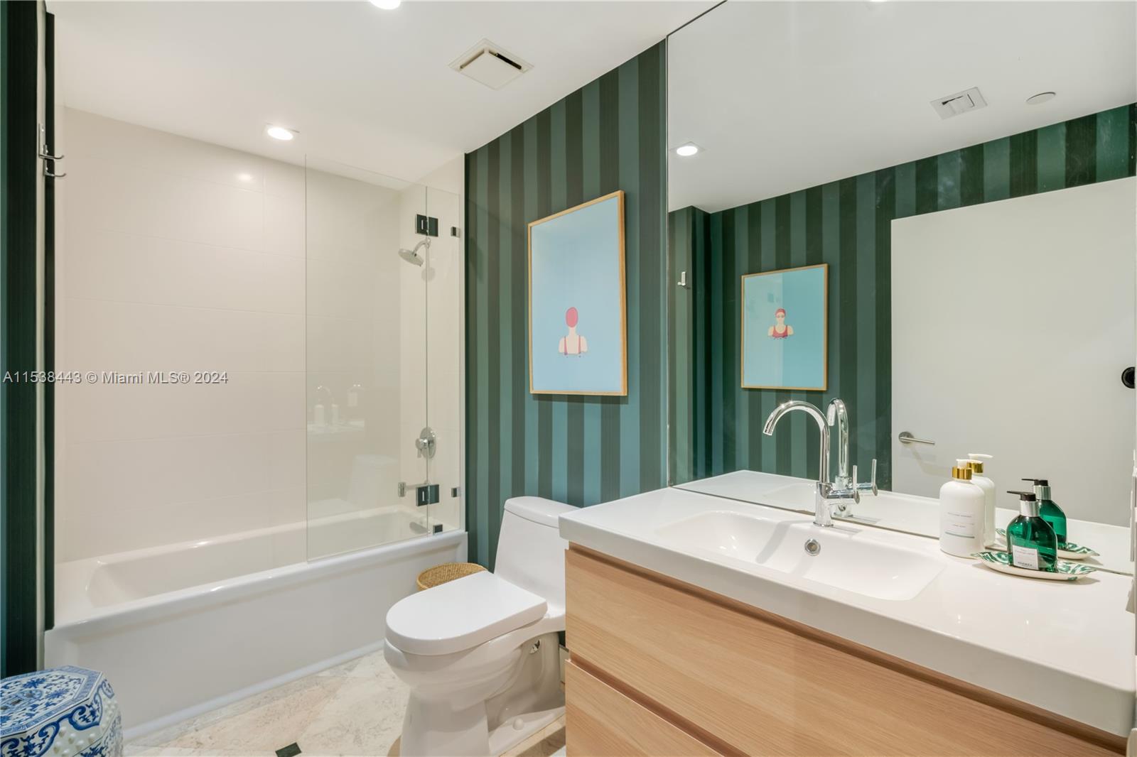 540 Brickell Key Drive, Unit 320 Miami, FL 33131 - Photo 19 of 32 a bathroom with a sink a toilet and shower