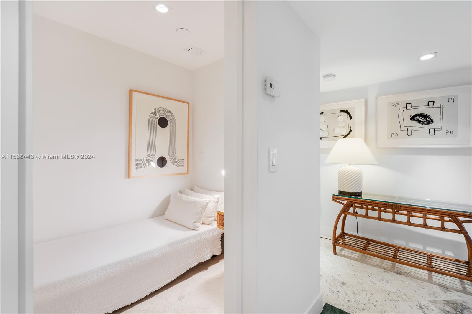 540 Brickell Key Drive, Unit 320 Miami, FL 33131 - Photo 21 of 32 a bathroom with a bathtub and a shower