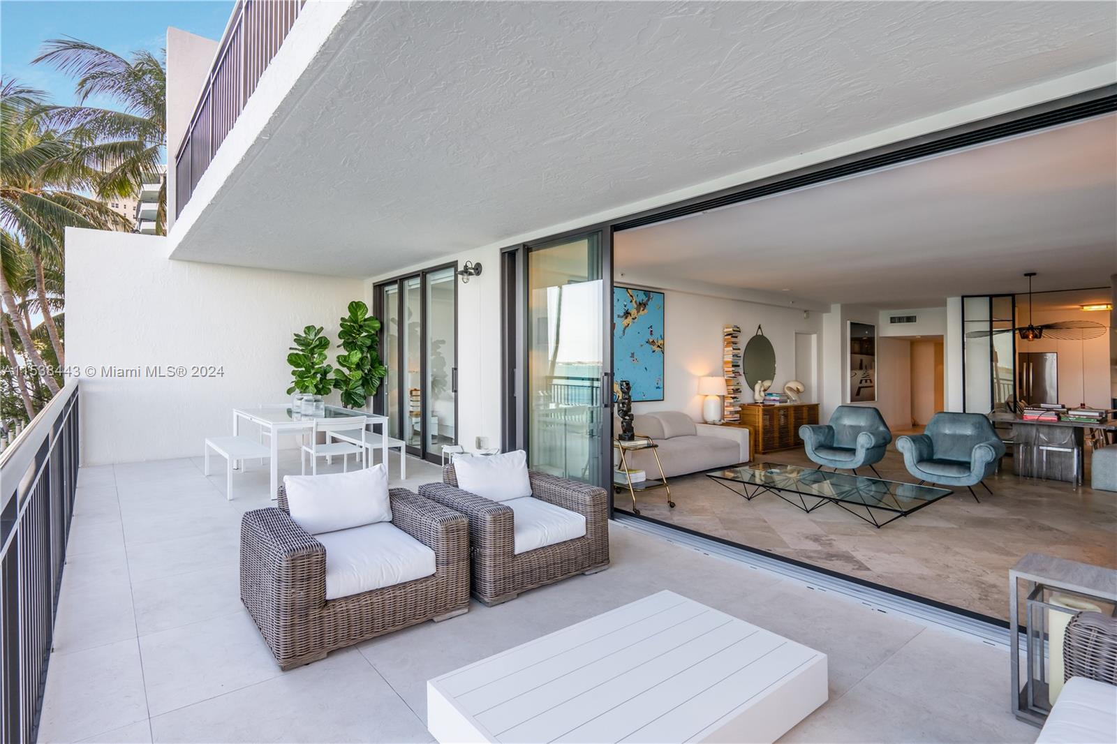 540 Brickell Key Drive, Unit 320 Miami, FL 33131 - Photo 24 of 32 a living room with furniture and large windows