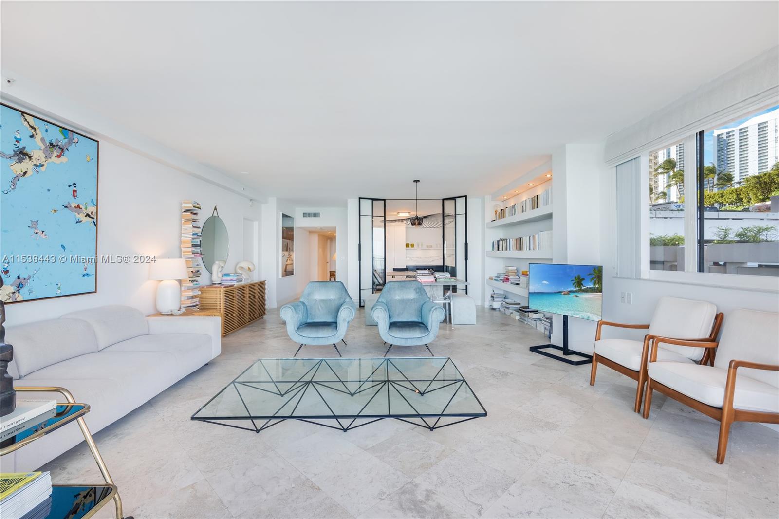 540 Brickell Key Drive, Unit 320 Miami, FL 33131 - Photo 3 of 32 a living room with furniture and a table