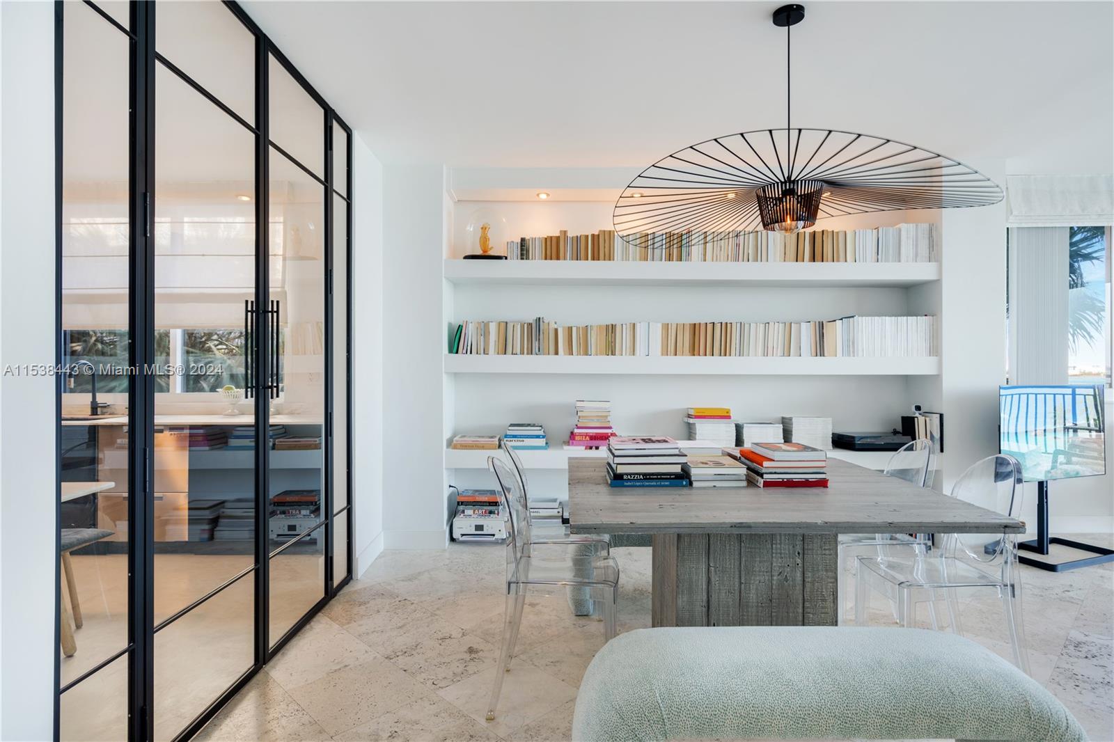 540 Brickell Key Drive, Unit 320 Miami, FL 33131 - Photo 6 of 32 a workspace with furniture window and a chandelier