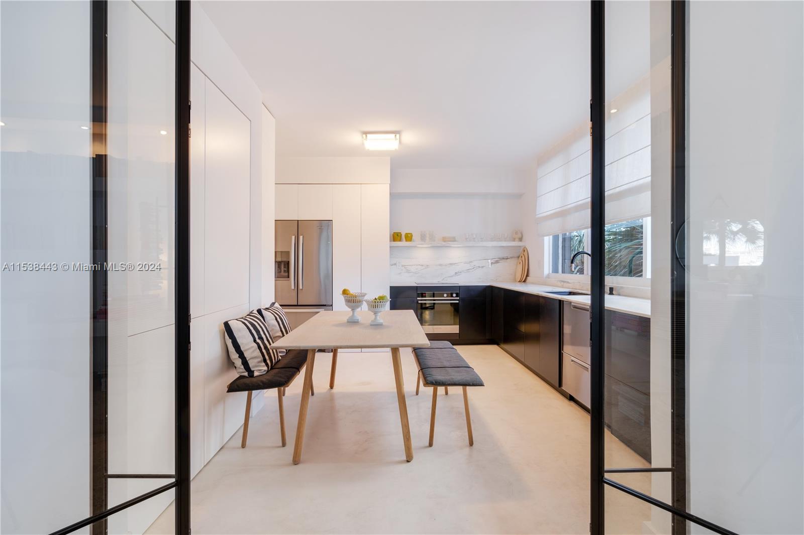 540 Brickell Key Drive, Unit 320 Miami, FL 33131 - Photo 10 of 32 a view of a dining room with furniture and wooden floor