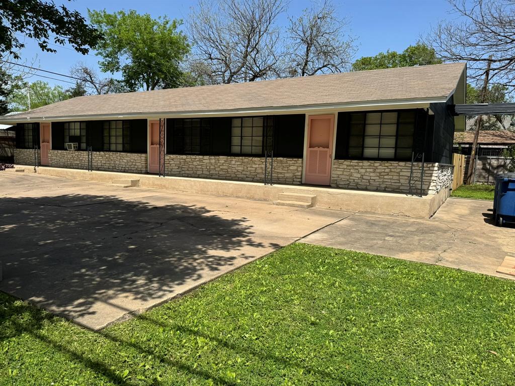 906 East 46th Street, Unit B Austin, TX 78751 - Photo 11 of 11 a front view of a house with a yard