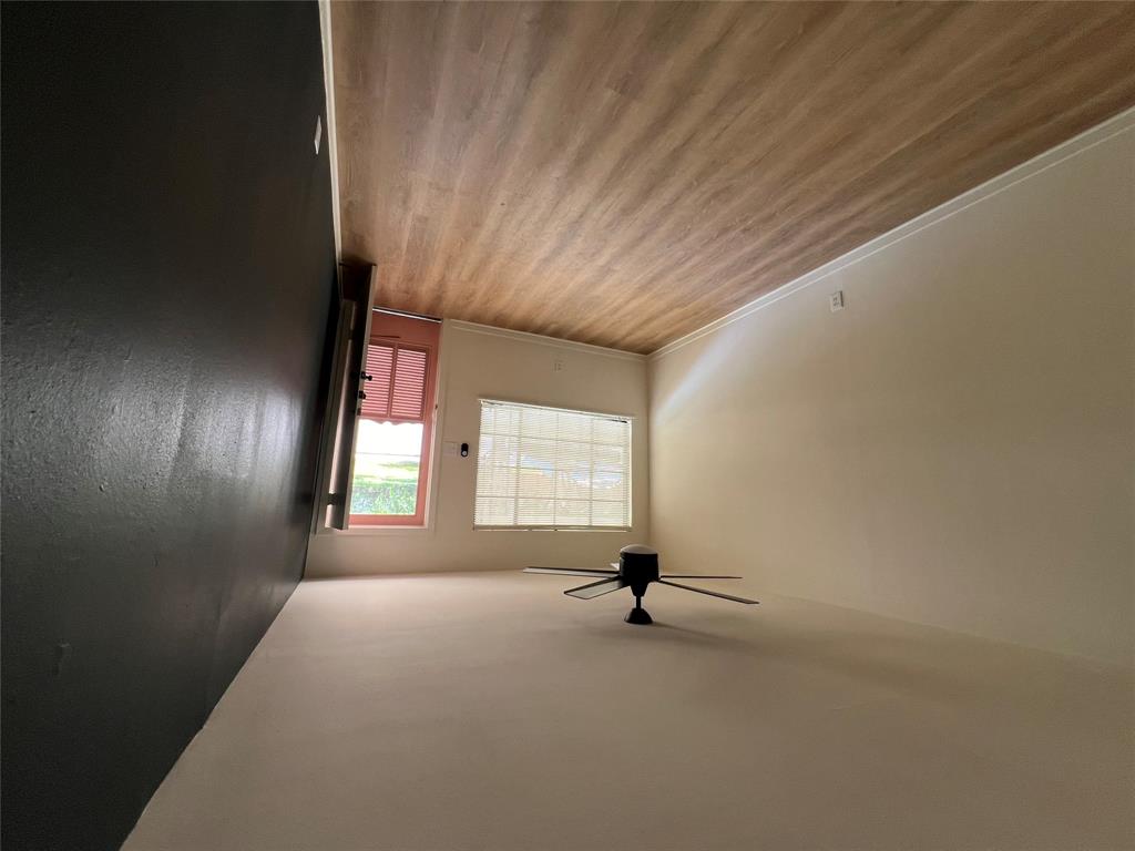906 East 46th Street, Unit B Austin, TX 78751 - Photo 3 of 11 wooden floor in an empty room with a window