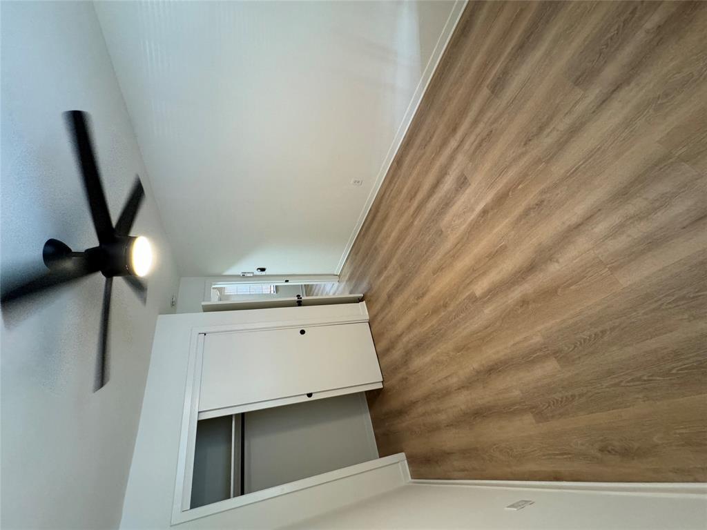 906 East 46th Street, Unit B Austin, TX 78751 - Photo 5 of 11 Bedroom featuring light wood finished floors, and a spacious closet.