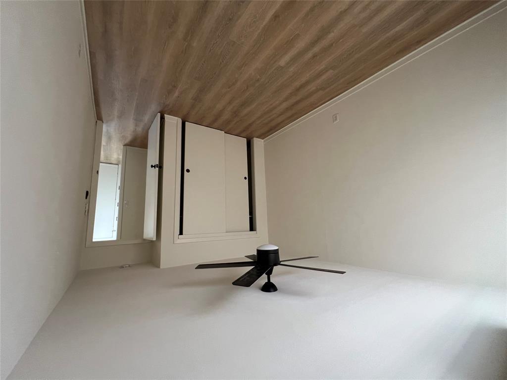 906 East 46th Street, Unit B Austin, TX 78751 - Photo 8 of 11 a view of empty room with wooden floor