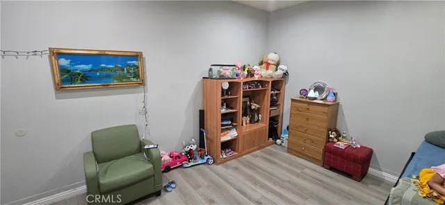 a living room with furniture stairs and a couch