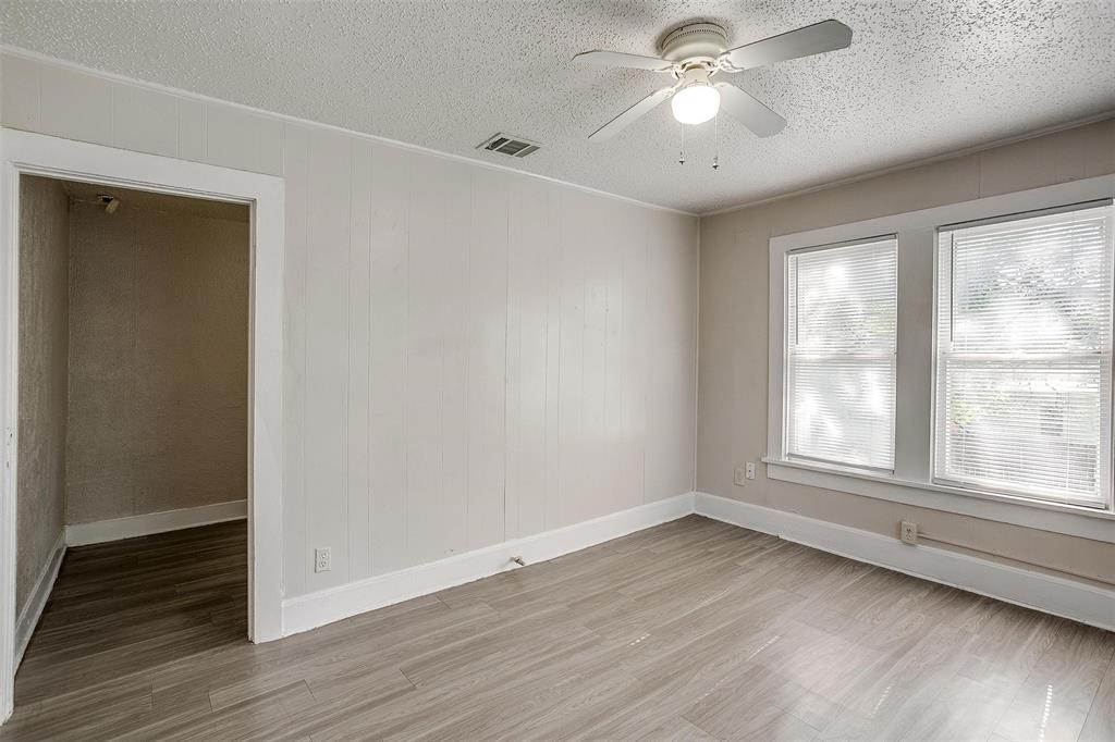 1411 6th Avenue, Unit 2 Fort Worth, TX 76104 - Photo 16 of 21 a view of empty room with wooden floor and fan