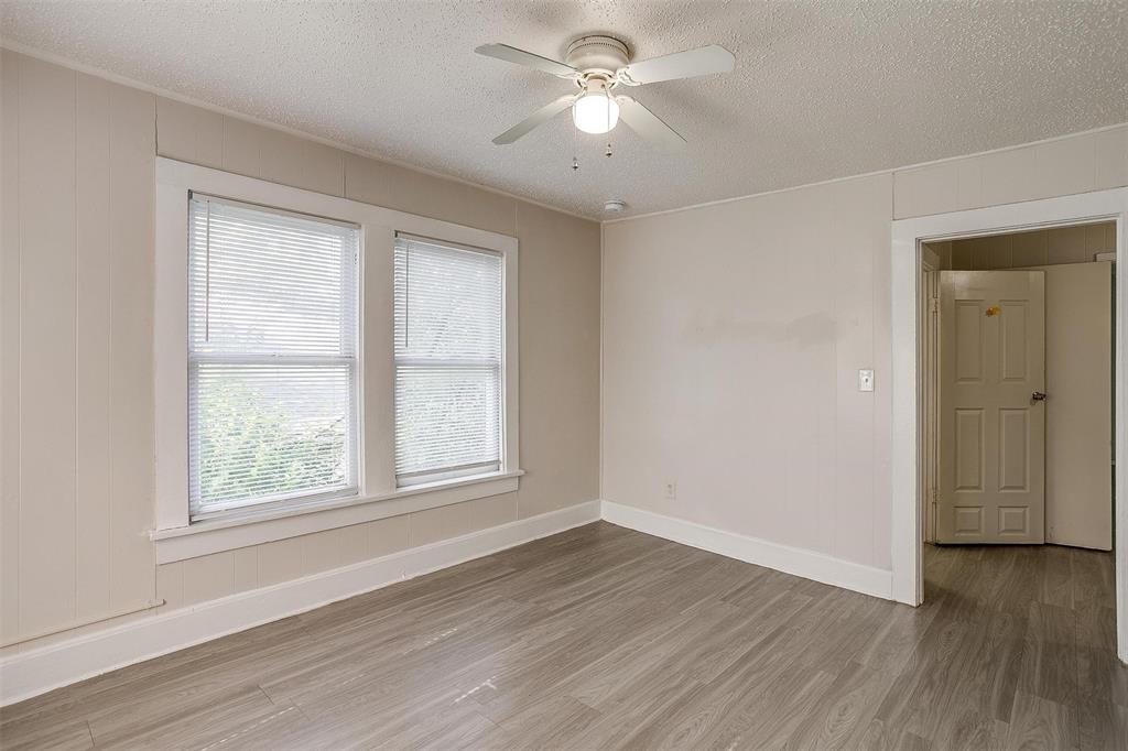 1411 6th Avenue, Unit 2 Fort Worth, TX 76104 - Photo 17 of 21 a view of empty room with wooden floor and fan