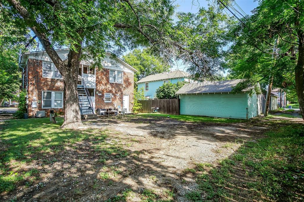 1411 6th Avenue, Unit 2 Fort Worth, TX 76104 - Photo 20 of 21 a view of a house with a tree beside it