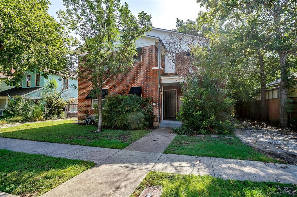 1411 6th Avenue, Unit 2 Fort Worth, TX 76104 - Photo 2 of 21 a front view of a house with a garden