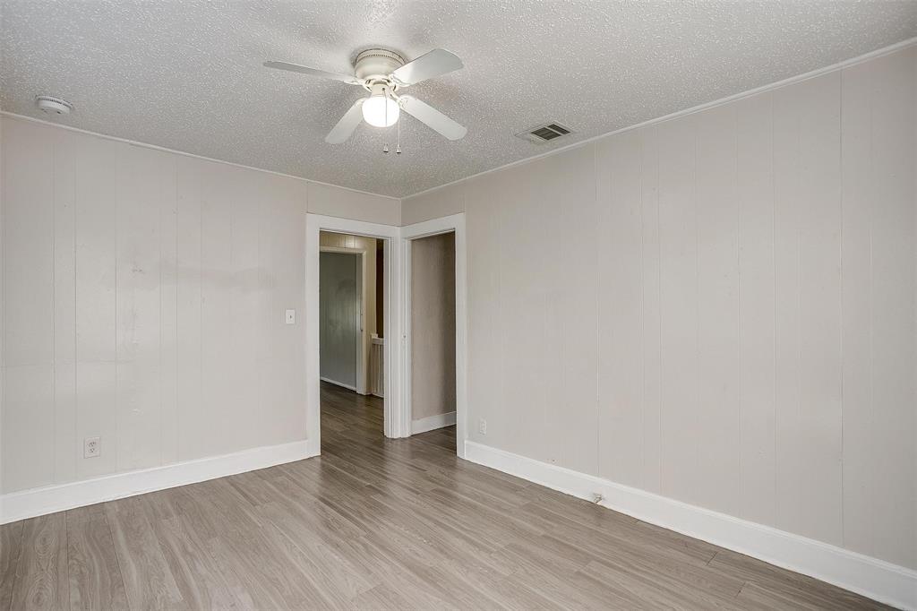 1411 6th Avenue, Unit 2 Fort Worth, TX 76104 - Photo 9 of 21 a view of an empty room with a window