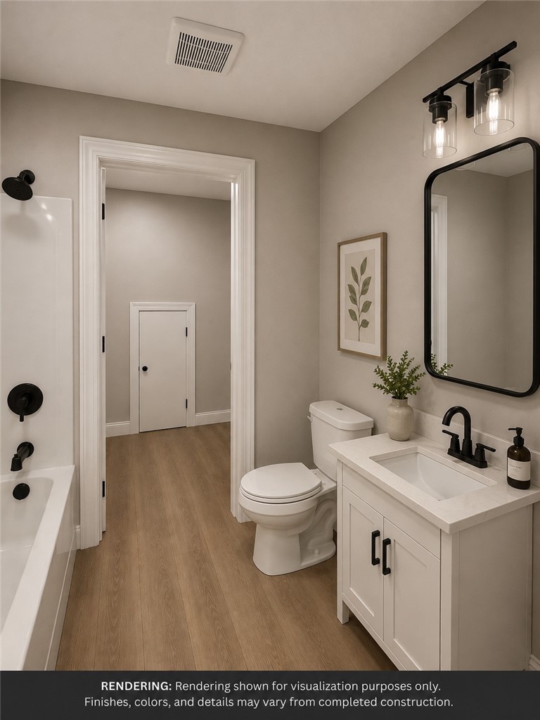 513 Quail Hollow Road Anderson, SC 29621 - Photo 32 of 39 This bright bathroom features warm flooring and a modern vanity, ideal for daily routines.
