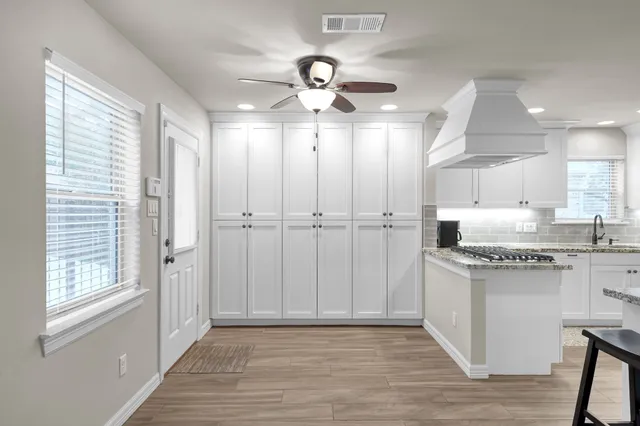 a view of a kitchen with electric appliances