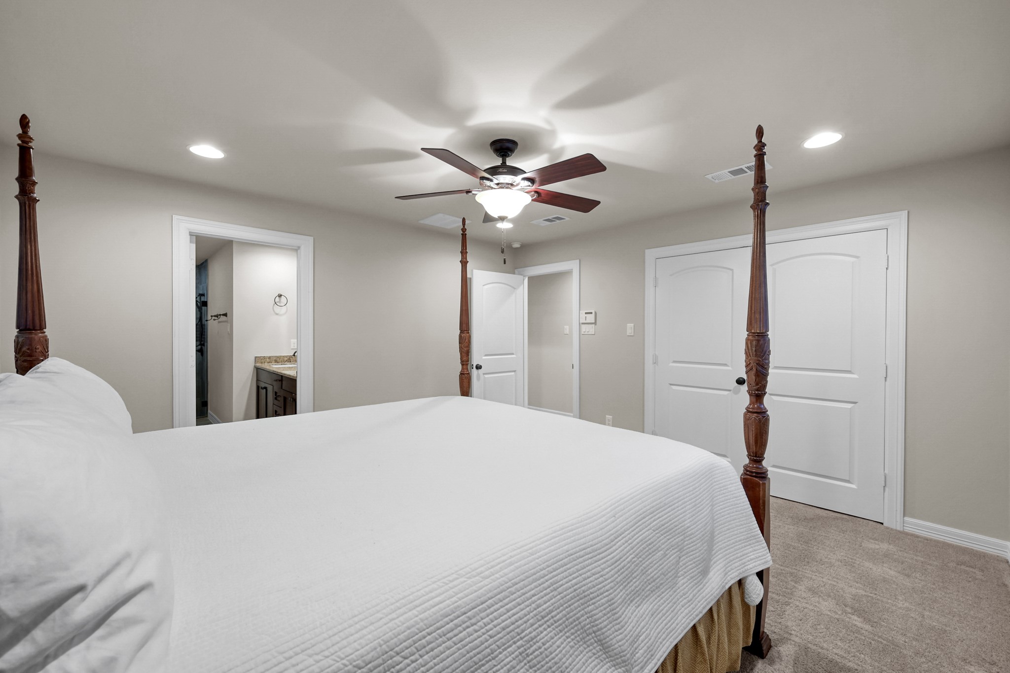 19003 Whitewood Drive Spring, TX 77373 - Photo 19 of 48 a bedroom with a bed and a ceiling fan
