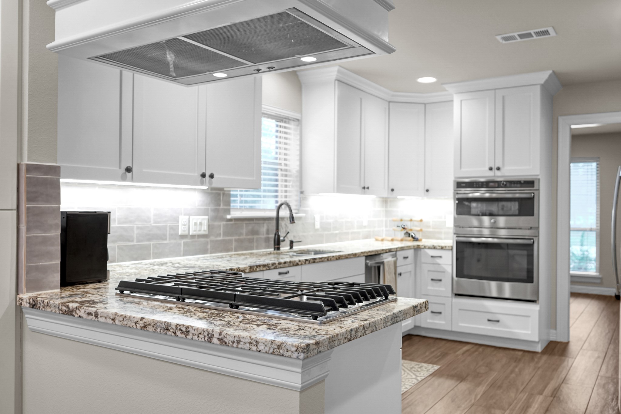 19003 Whitewood Drive Spring, TX 77373 - Photo 2 of 48 a kitchen with granite countertop a stove and a sink