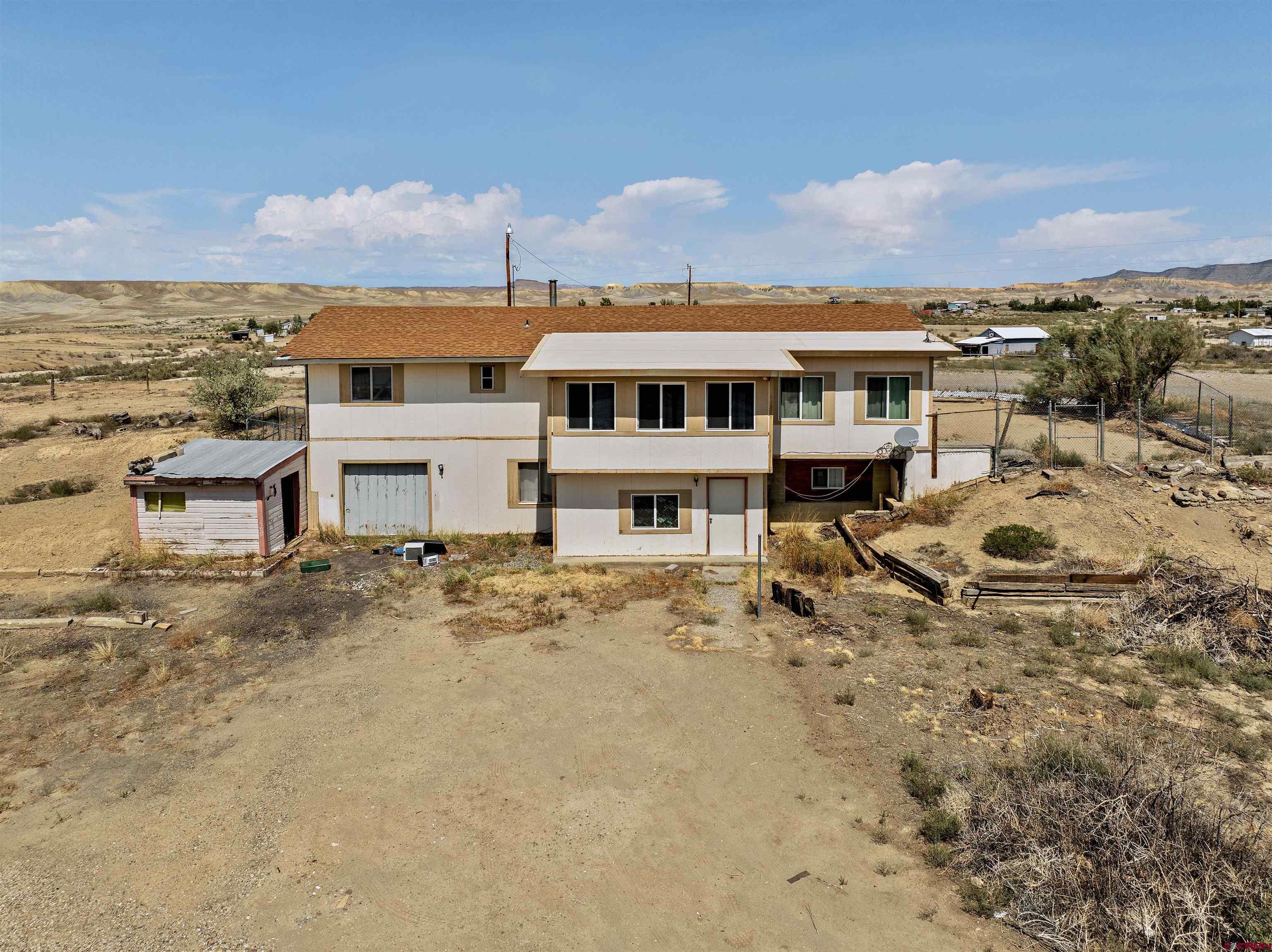 160 Reeder Mesa Road Whitewater, CO 81527 - Photo 13 of 22 an aerial view of a house with a yard and lake view