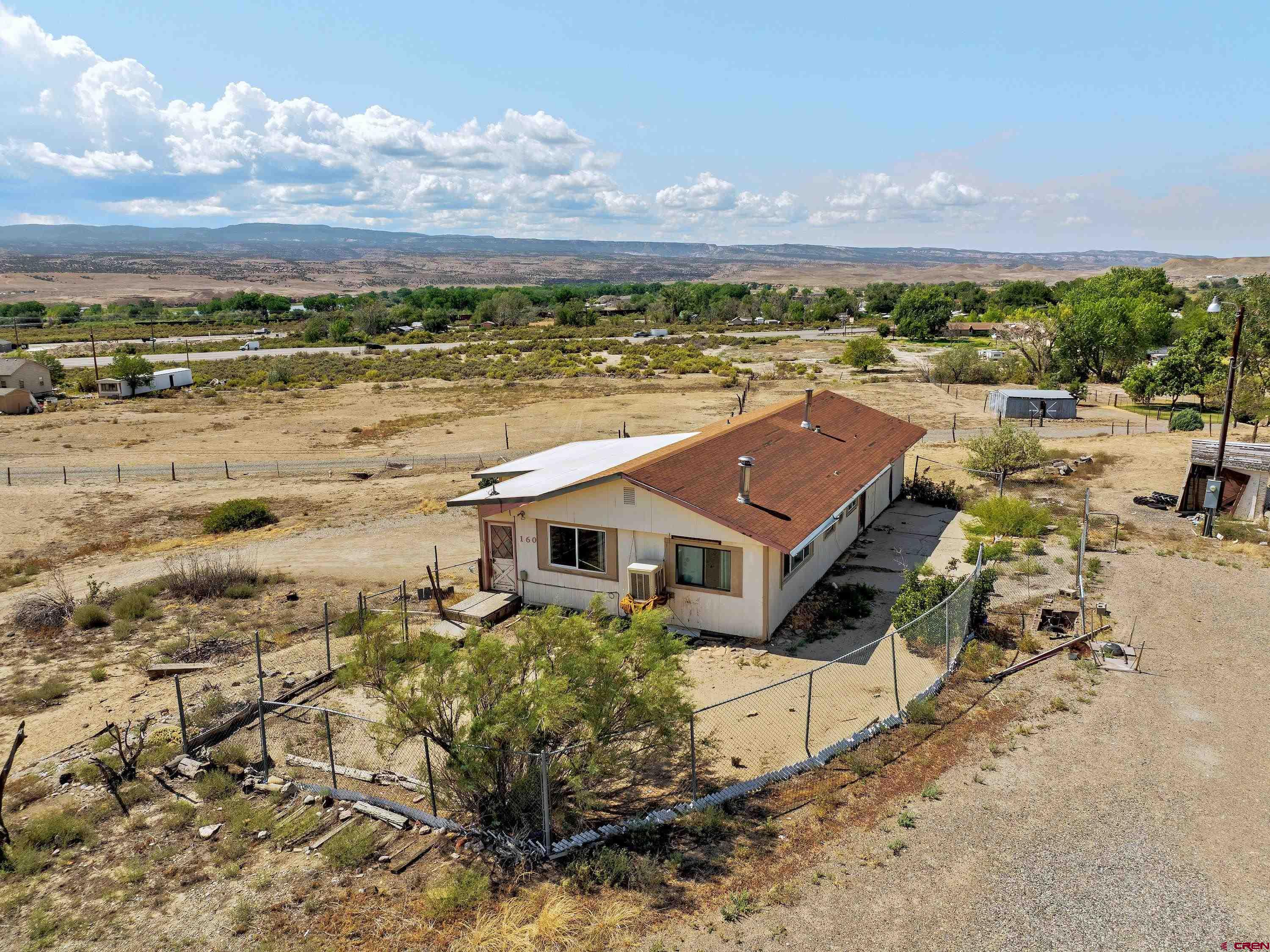 160 Reeder Mesa Road Whitewater, CO 81527 - Photo 3 of 22 a aerial view of a house with a lake view