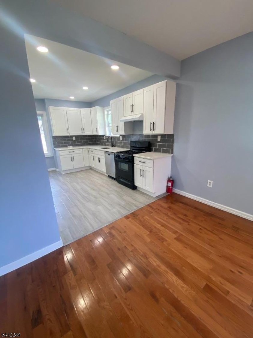 17 Walnut Terrace Bloomfield, NJ 07003 - Photo 15 of 18 a kitchen with stainless steel appliances a refrigerator sink and cabinets