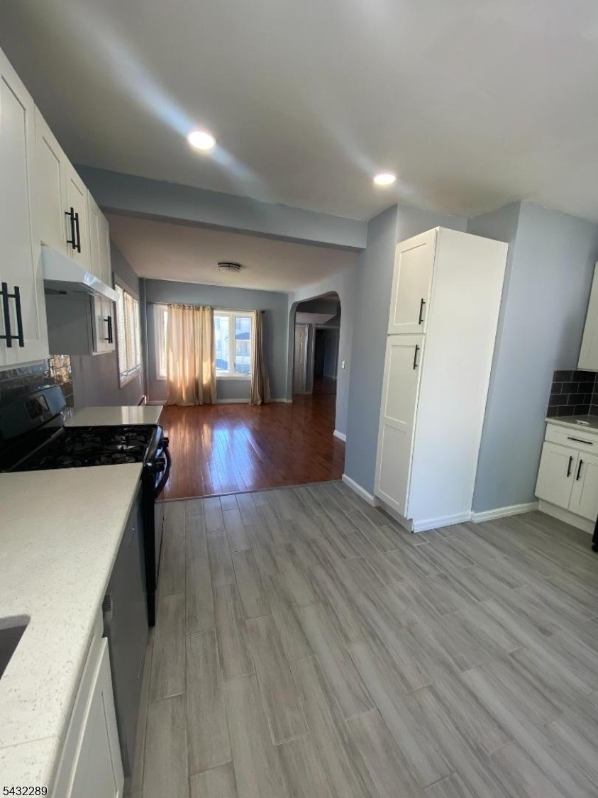 17 Walnut Terrace Bloomfield, NJ 07003 - Photo 16 of 18 a view of a living room hardwood floor and a kitchen
