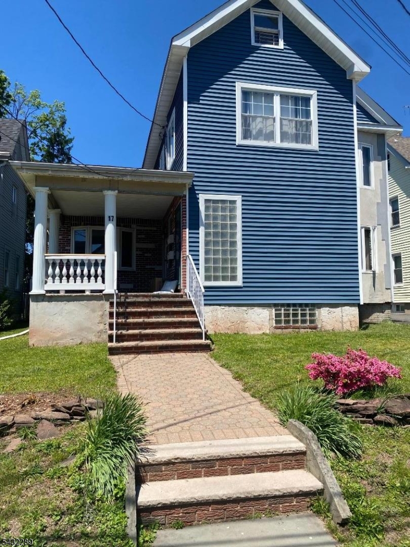 17 Walnut Terrace Bloomfield, NJ 07003 - Photo 17 of 18 a front view of a house with a yard