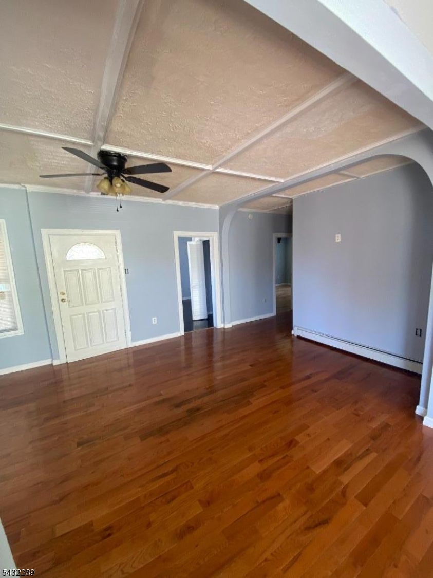 17 Walnut Terrace Bloomfield, NJ 07003 - Photo 3 of 18 a view of empty room with wooden floor