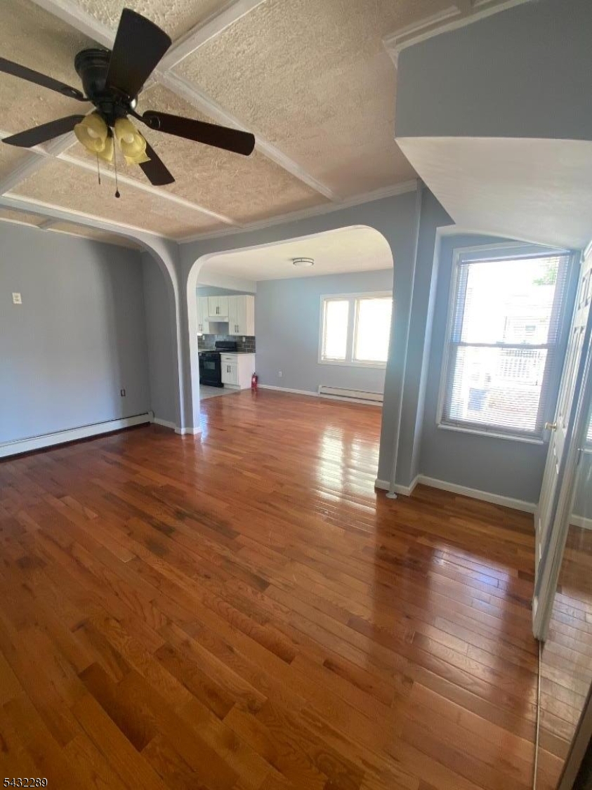 17 Walnut Terrace Bloomfield, NJ 07003 - Photo 5 of 18 a view of empty room with wooden floor