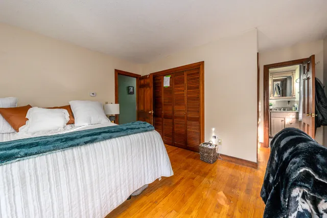 a bedroom with a bed and walk in closet