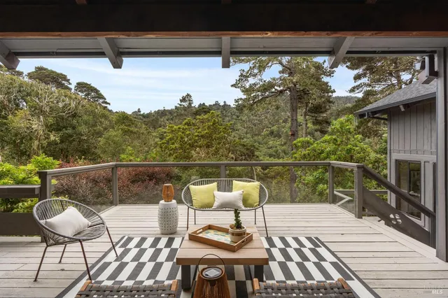a view of balcony with wooden floor