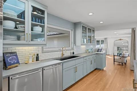 a kitchen with sink and cabinets