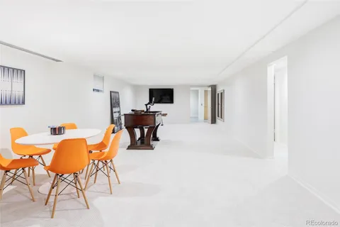 a workspace with furniture and a window