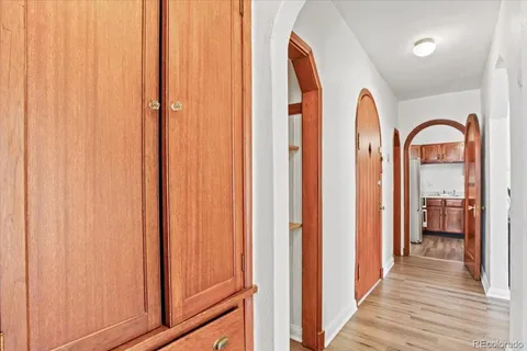 a bedroom with a bed and a potted plant