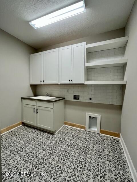 3880 Eagle Rock Road Middleburg, FL 32068 - Photo 4 of 7 a kitchen with a sink a stove and cabinets